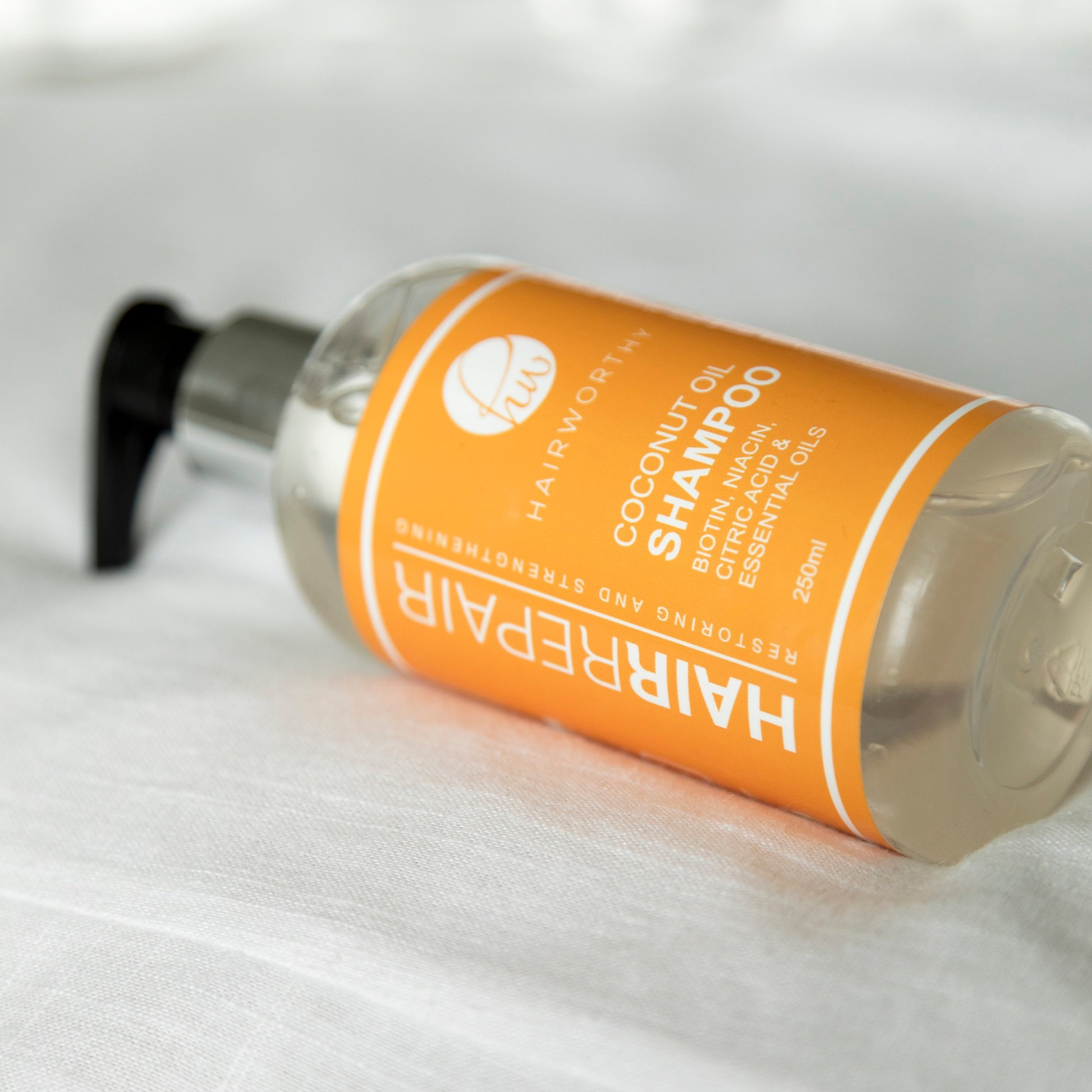 Blushbeam Hair Repair Shampoo in bathroom setting